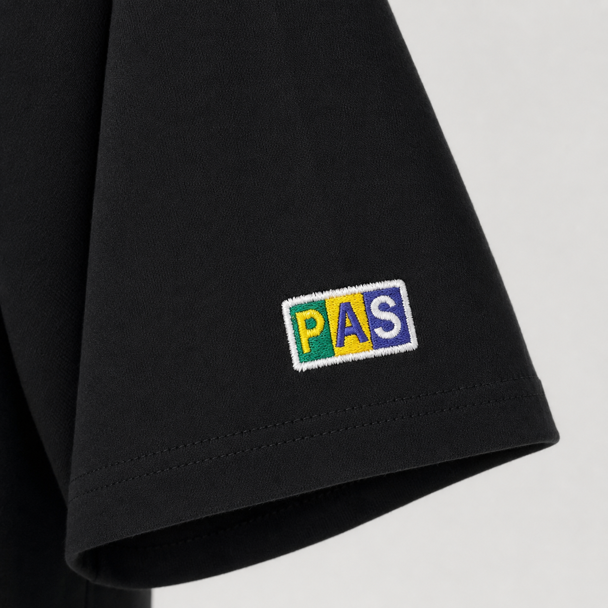 PAS Amor e Progresso Brasil black tee – cross and stars chest graphic, Amor e Progresso No.10 back design, Brazil-colored PAS patch on sleeve