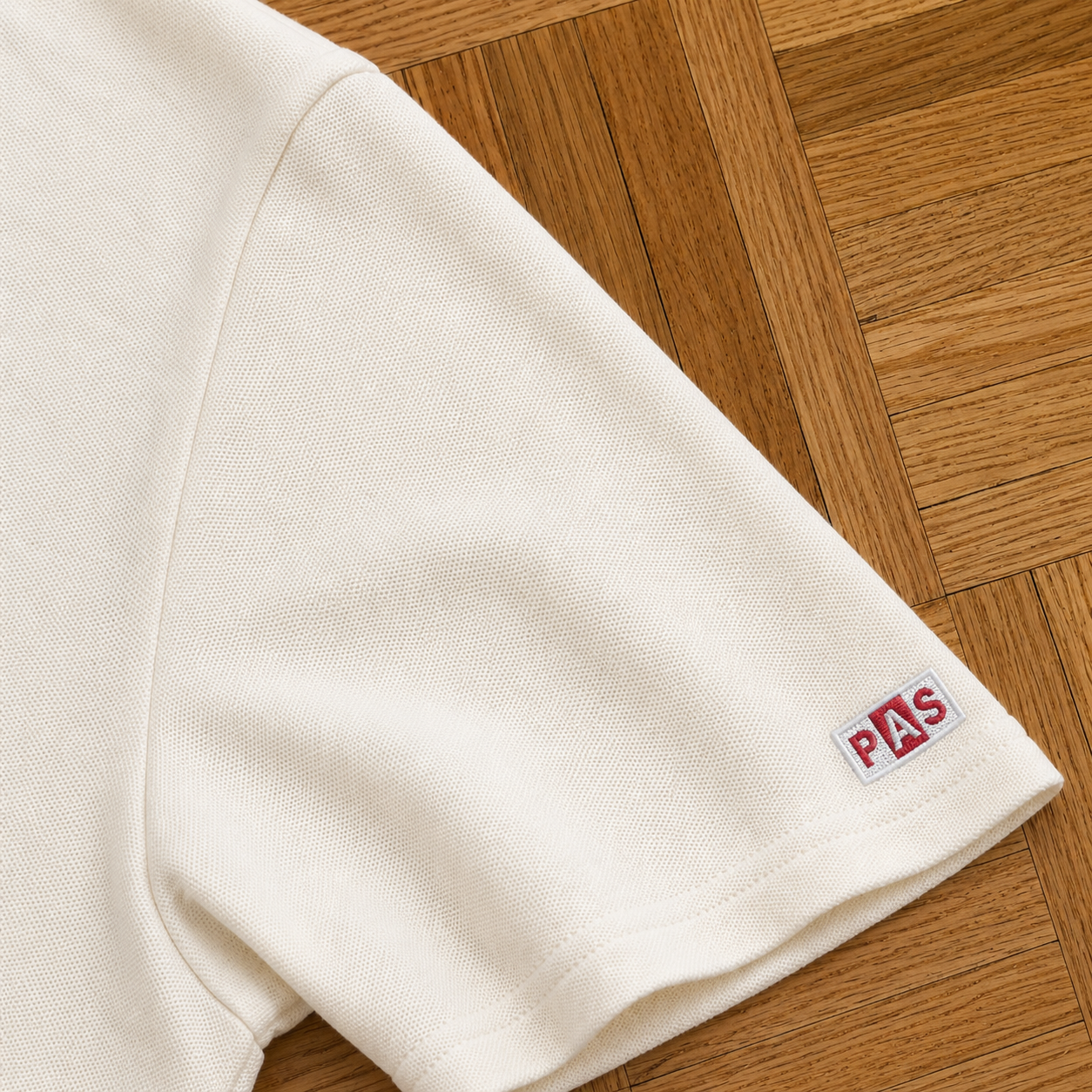 PAS x England white slim fit polo – Three Lions and It's Coming Home chest graphic, The Cambridge Rules pitch and roses back design, PAS patch on sleeve