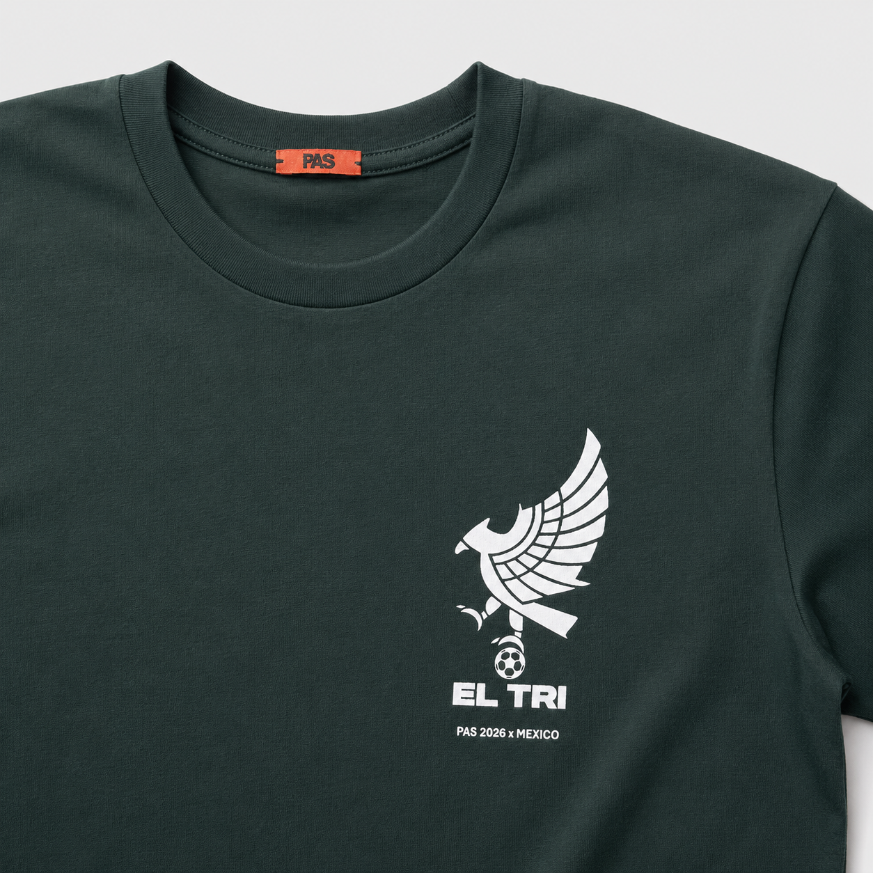 PAS x Mexico Rompe La Maldición El Tri dark green tee – close-up of El Tri eagle and soccer ball chest graphic